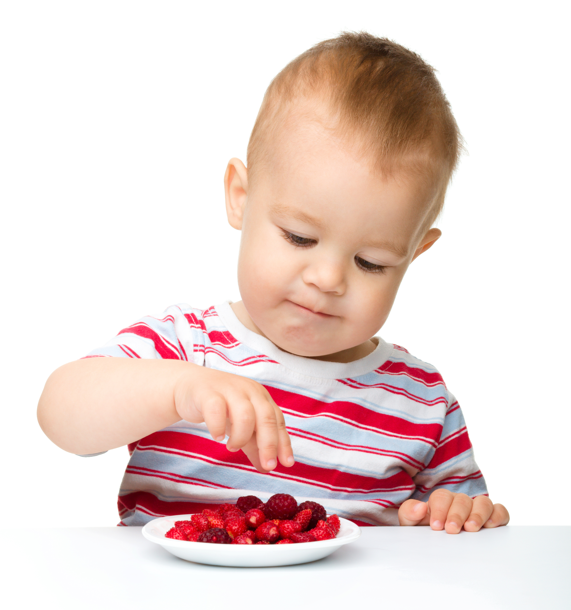 Cute little boy with strawberries