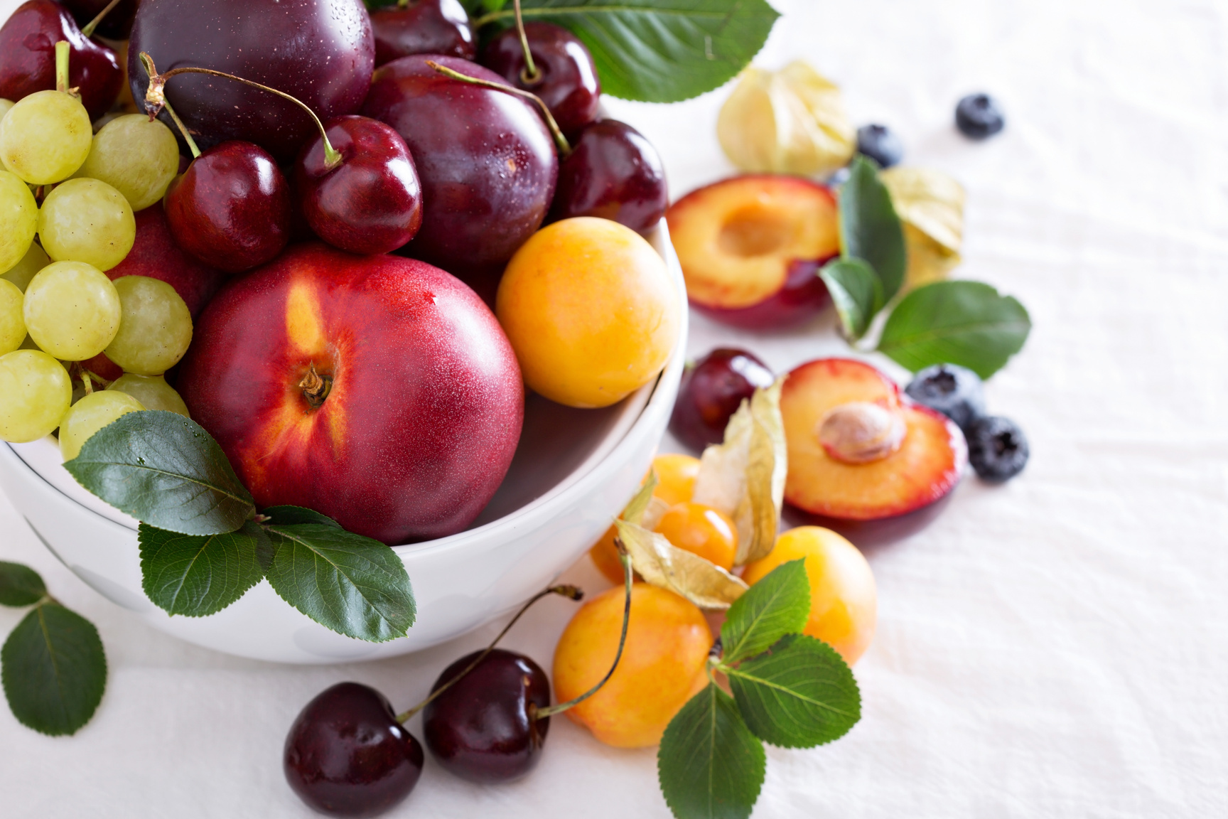 A bowl of fruit on a table